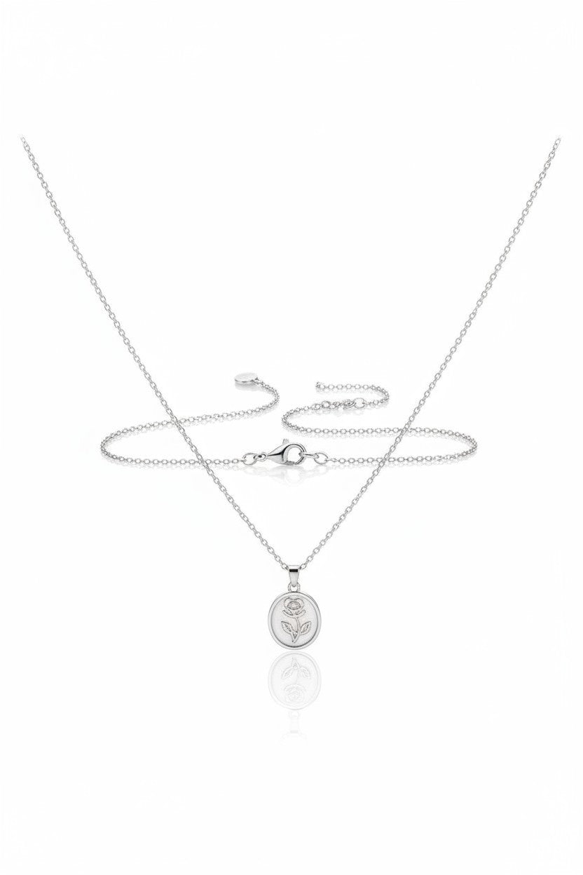 Ownline Galleria sterling silver necklace with oval rose pendant. Delicate engraving, polished finish, fine chain.