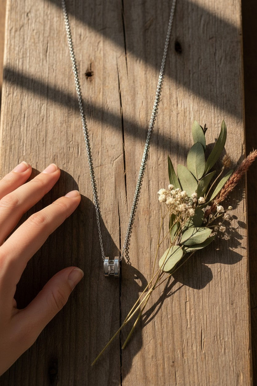 Ownline Galleria sterling silver pendant necklace with cylindrical charm and crystal accents on a delicate chain.